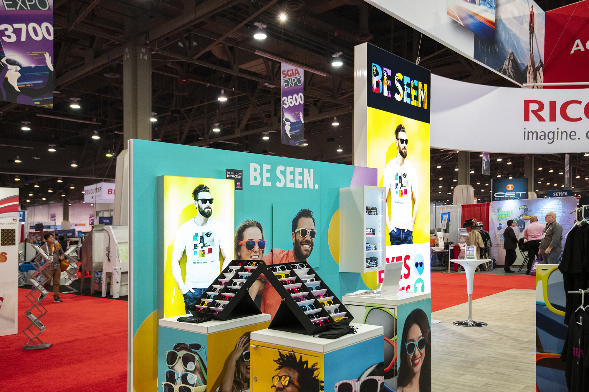 A photo of a live tradeshow events highlight the booth design.