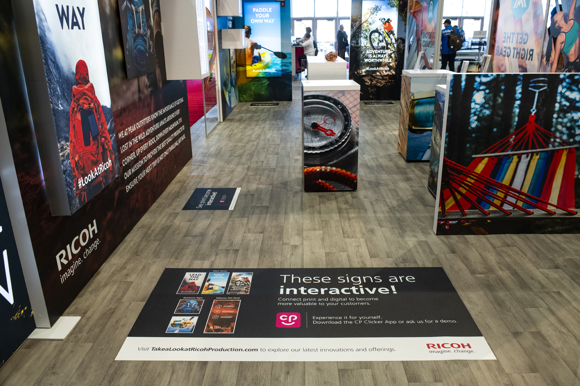 A photo of a live tradeshow events highlight the booth design.