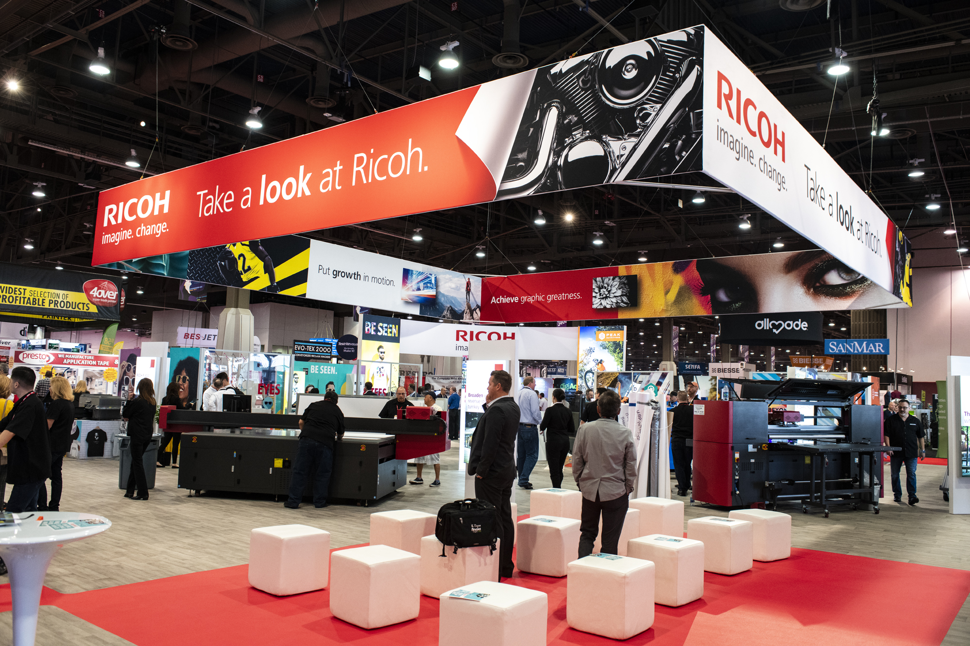 A photo of a live tradeshow events highlight the booth design.